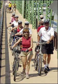 Leading the Valley Forge SOBs (Singles on Bikes) across the New Hope-Lambertville Bridge are Viviana Amzel and Al Schiavo. Being on my own I need an environment. Its having a group of people to do things with and not have to worry about being hit upon. Amzel, of Gladwyne, said of the group.