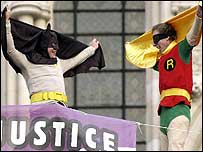 Protesters dressed as superheroes