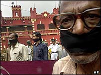 Members of the Association for Protection of Democratic Rights (APDR) stage a silent protest outside the prison where  Chatterjee was executed