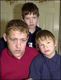 Tragic ... Paul after the attack with sons Ashley, front, and Simon