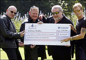 Fans a lot ... Stranglers present cheque