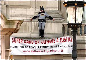 Protest ... campaigner bats away attempts to get him down