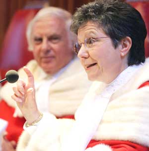 Supreme Court Justice Louise Charron speaks  Monday after being sworn in during a ceremony in Ottawa. Fellow judge Morris  Fish looks on. Jonathan Hayward/CP